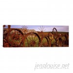 East Urban Home 'Old Barn with a Fence Made of Wheels, Palouse, Washington State' Photographic Print on Canvas EUBN9581